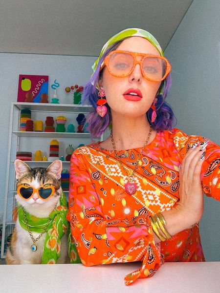 Fall transitional outfit 🍂🌸

Champagne wears a multicolored orange red and yellow gold maxi dress from Never Fully Dressed, green leather boots and neon like green feather rhinestone purse bag, pink heart necklace and earrings, orange sunglasses. 

Dopamine dressing colorful vibrant eclectic maximalist maximalism rainbow multicolored colored hair style fashion inspo color fall Halloween witch costume #LTKHalloween 

#LTKstyletip #LTKSeasonal
