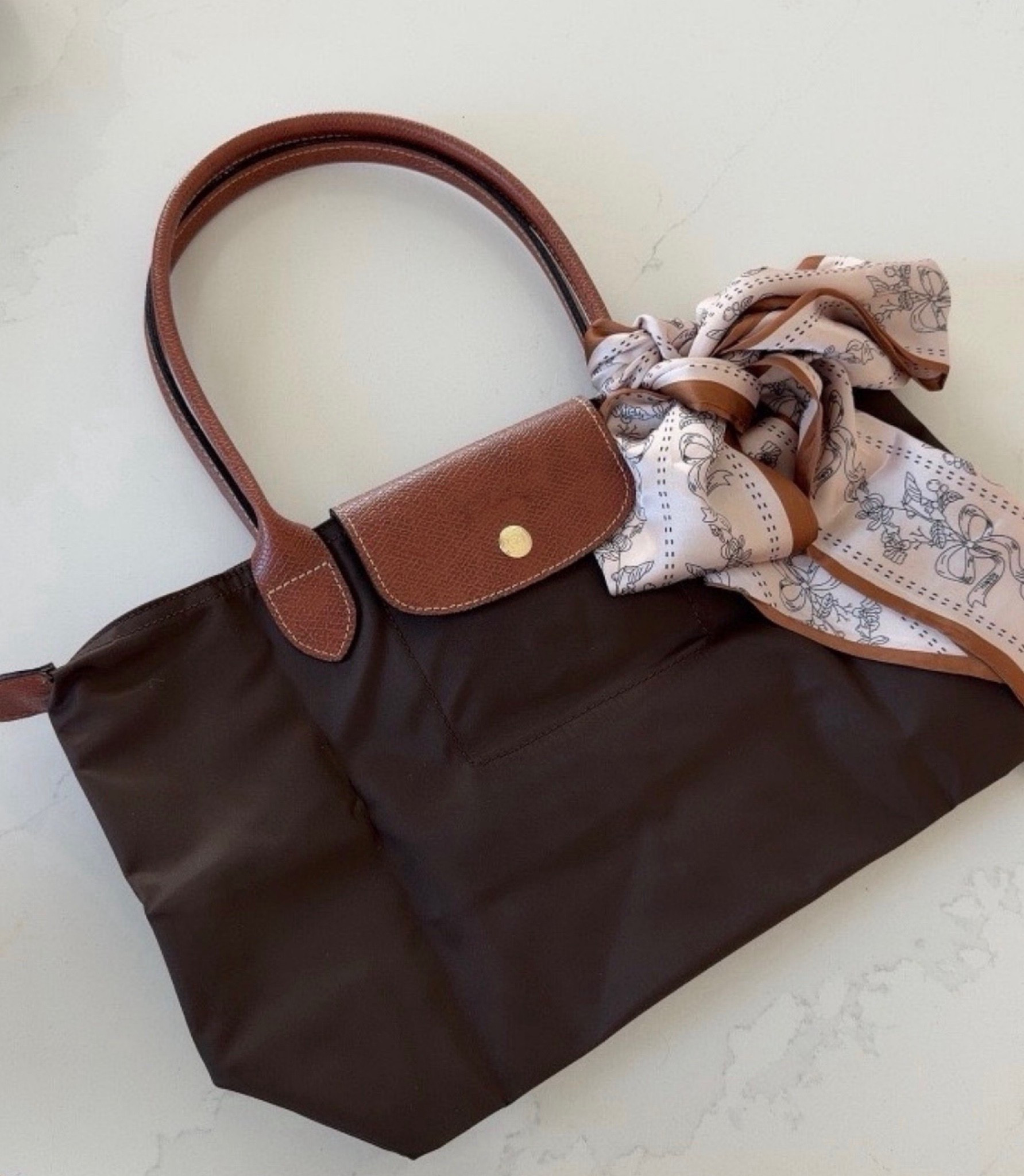 This bag is such a cute Amazon accessory find, and the color makes it easy to wear with so many outfits. The added scarf detail gives it a fun, styled look without feeling overdone. Such a pretty everyday handbag for adding a little something extra to simple outfits.

#LTKSeasonal #LTKOver40 #LTKdayinmylife