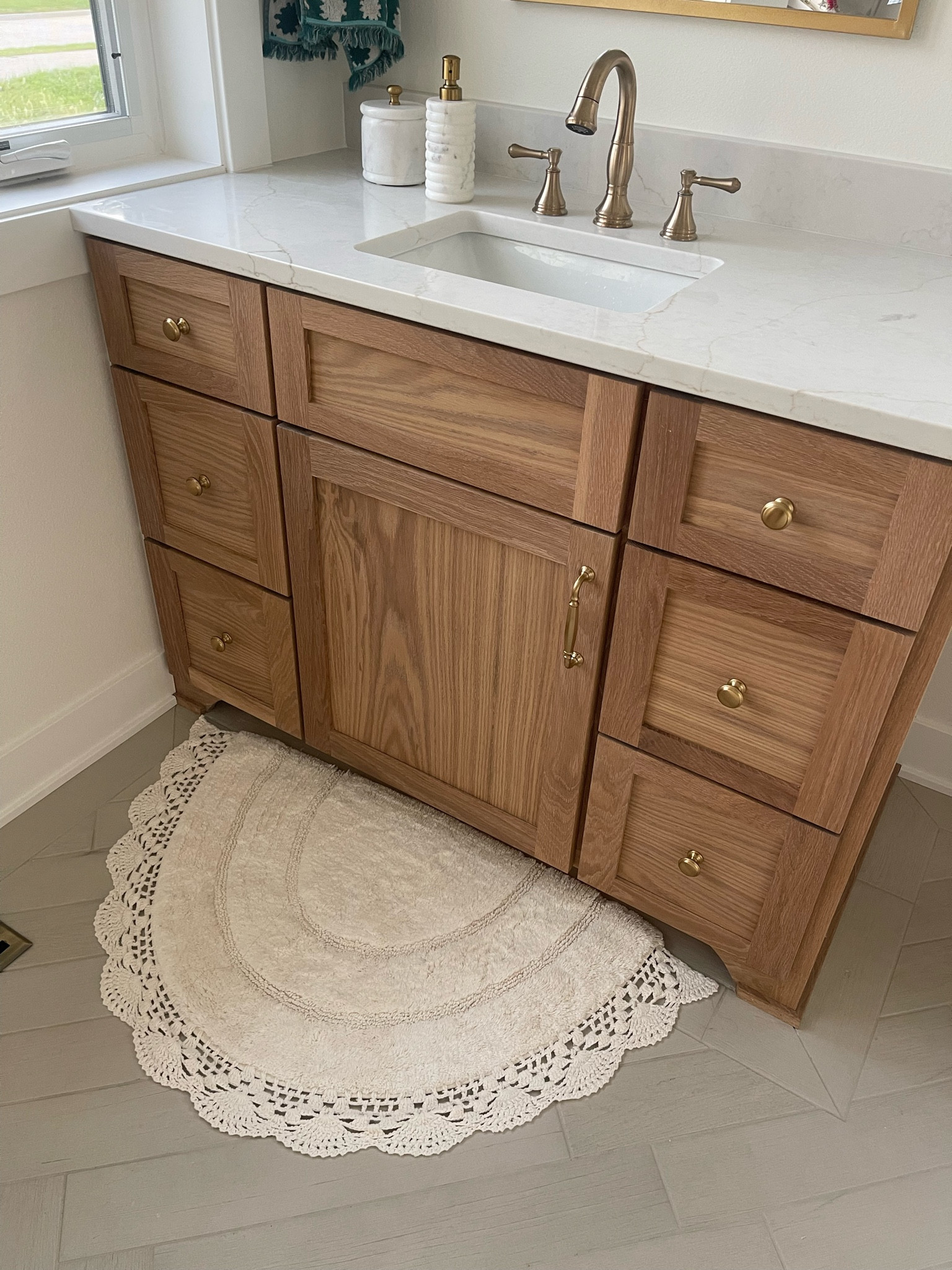 Bathroom Vanity // Top Knobs Honey Bronze // Delta Champagne Bronze Sink Faucet // Counter Tops: Calacatta Valentin Quartz // Husk Homes Custom Built Homes // Iowa Custom Built Home // 

#LTKHome