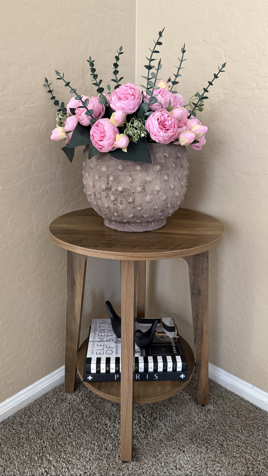 This cute two-tier side table from Amazon and wall art from Target create a charming corner styling in a small space. The table is sturdy enough to hold several books or decorative items.

#LTKSeasonal #LTKHome #LTKSaleAlert