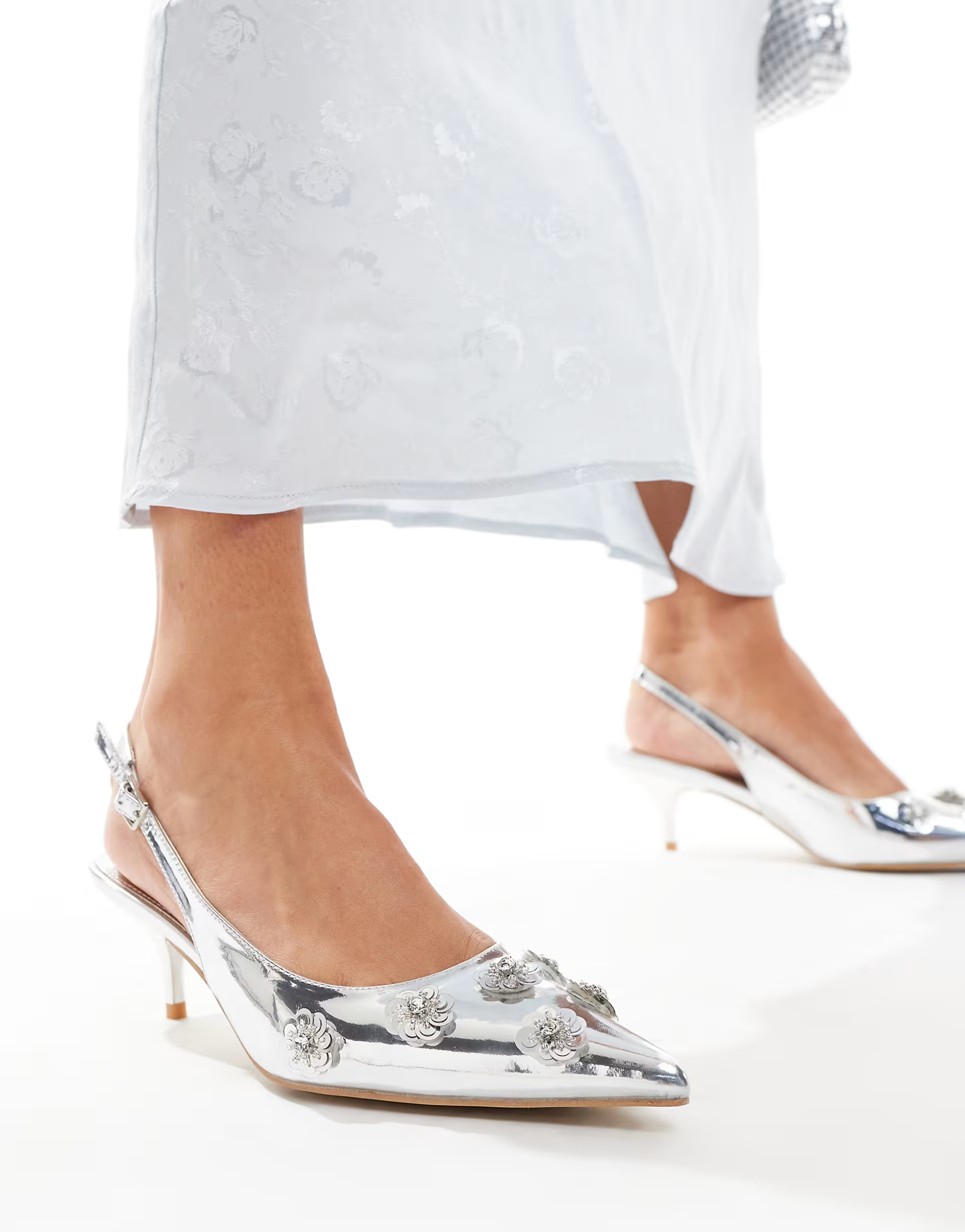 Public Desire Kyle sling back pointed kitten heels with 3D embellished flowers in silver | ASOS (Global)