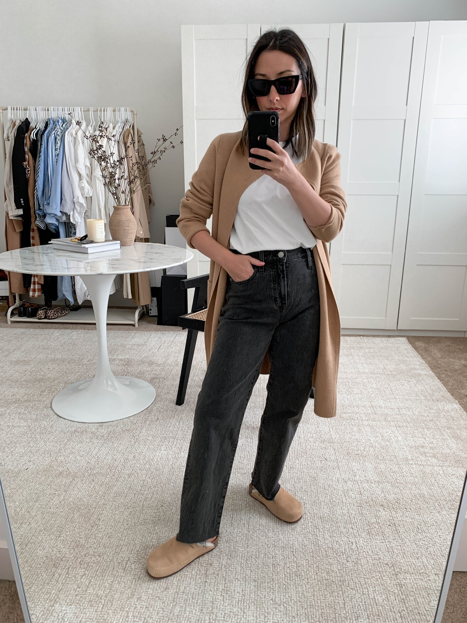 J.crew Juliette cardigan in xxs. This is a great longer cardigan option for petites. Hits around the knee. 

Cardigan - J.crew xxs
Tee - Everlane medium
Jeans - Madewell 23 petite
Clogs - Jenni Kayne 36
Sunglasses - YSL 