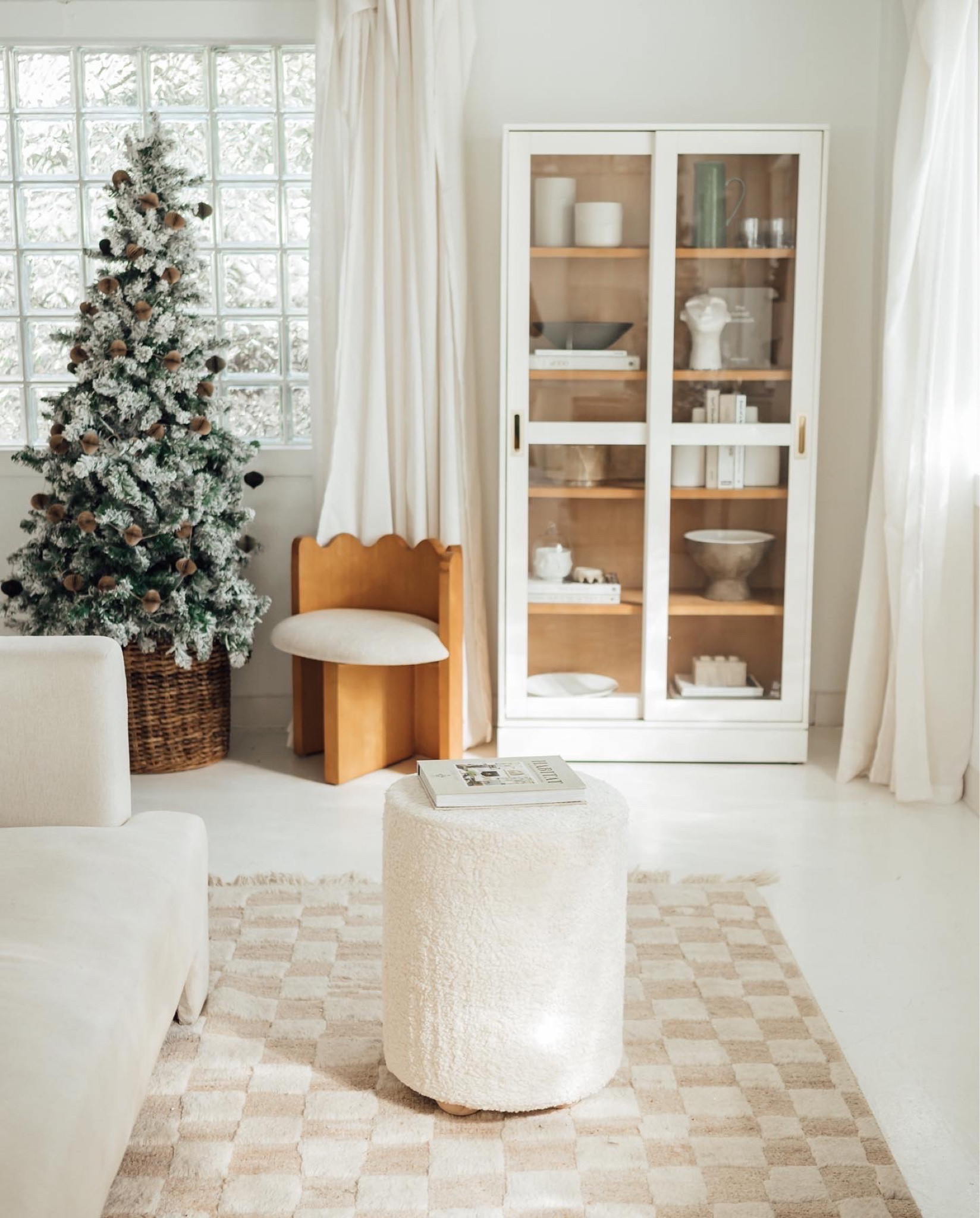 Sherpa woodfooted seat, coffee table book, cement sculpture head.

#homedecor #home #interiordesign 

#LTKsalealert #LTKhome #LTKHoliday