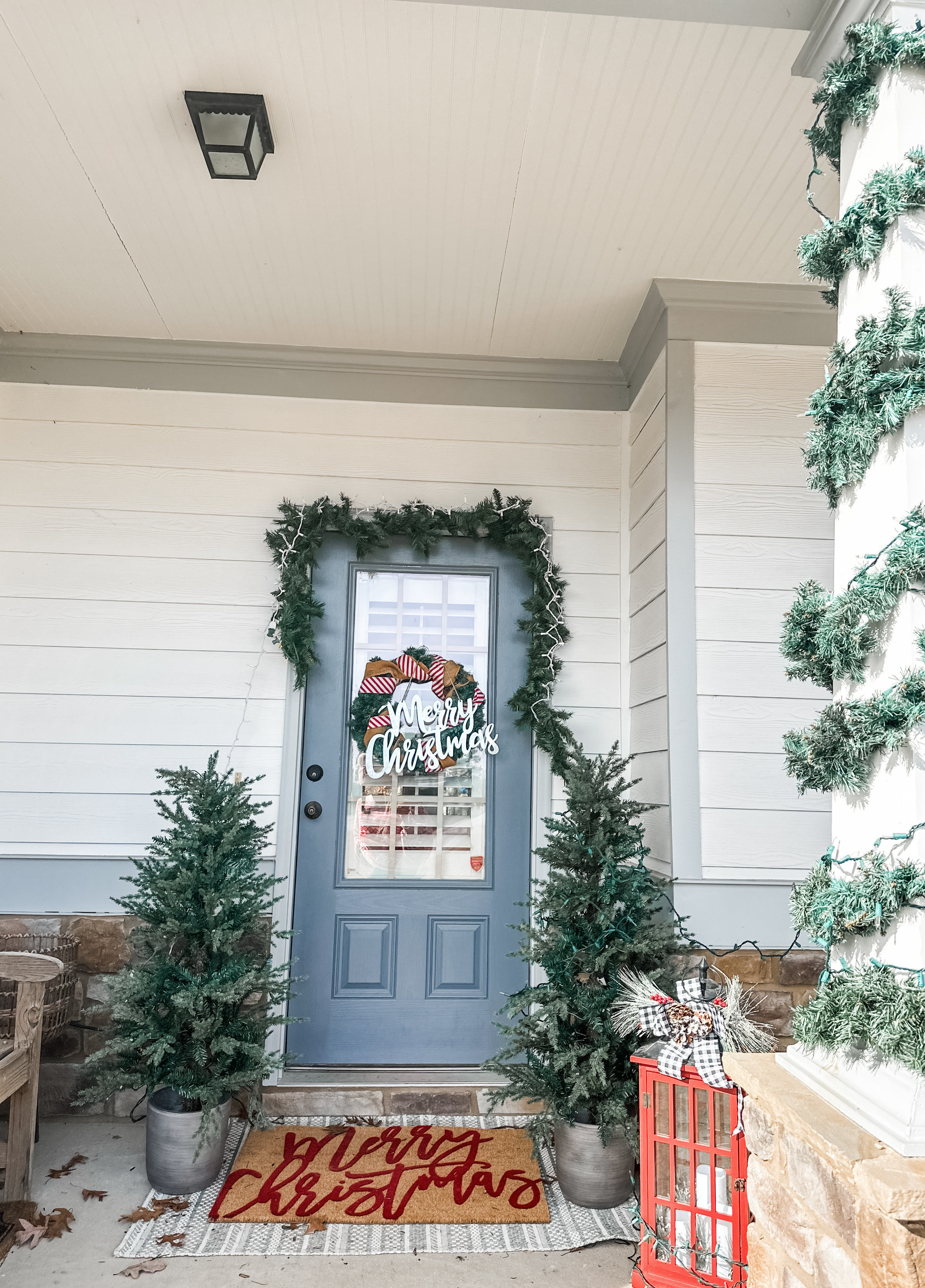 Christmas front porch decor ideas! Pre-lit trees and Christmas garland! 

#LTKHome #LTKHoliday