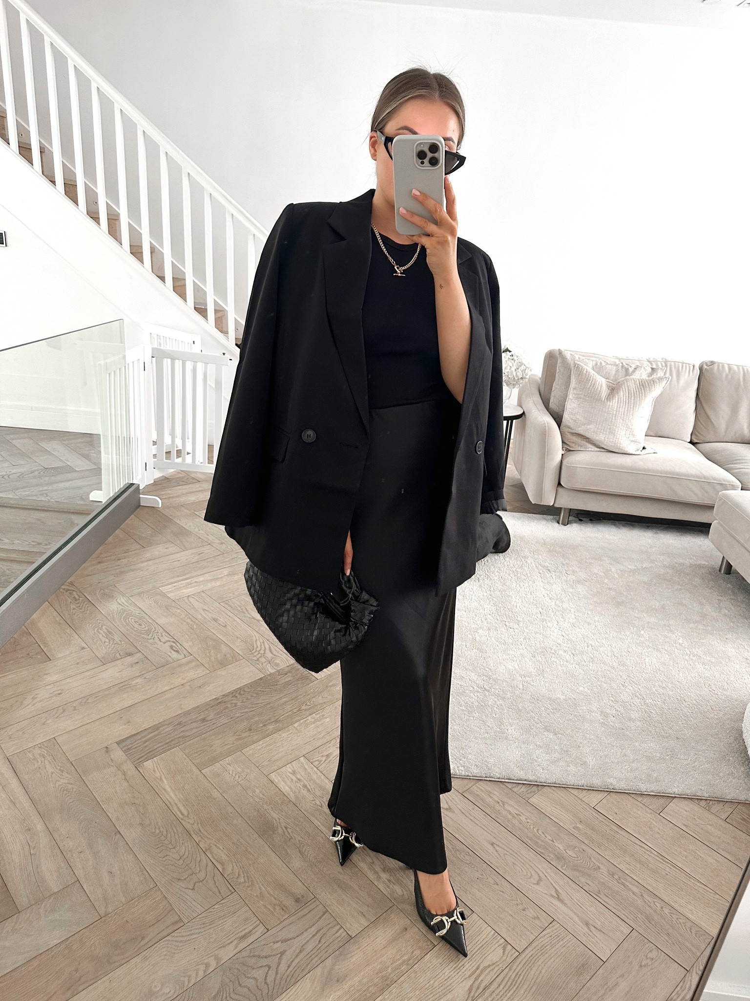 Spring summer all black outfit from new look - black satin midi skirt, black fitted top, black oversized blazer, woven handbag, gold jewellery & slingback heels. 

#LTKeurope #LTKstyletip #LTKSeasonal