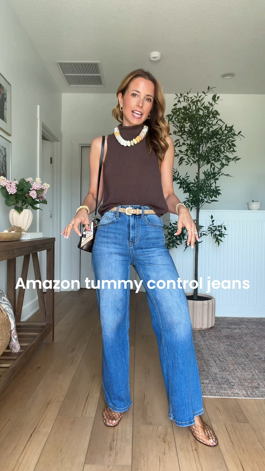 My outfit of the day! Elevated casual outfit. Summer outfit. Fall outfit. Mom outfit. My favorite Amazon tummy control jeans are back! So stretchy and won’t lose shape. Size down if in between sizes. Wearing size 24 and 30” inseam, color is ‘Medium blue’. New Anthropologie rolled neck sweater tank in XXS. Jelly ballet flats run a smidge big and are whole sizes only. I’m a 6.5 and sized down to a 6.