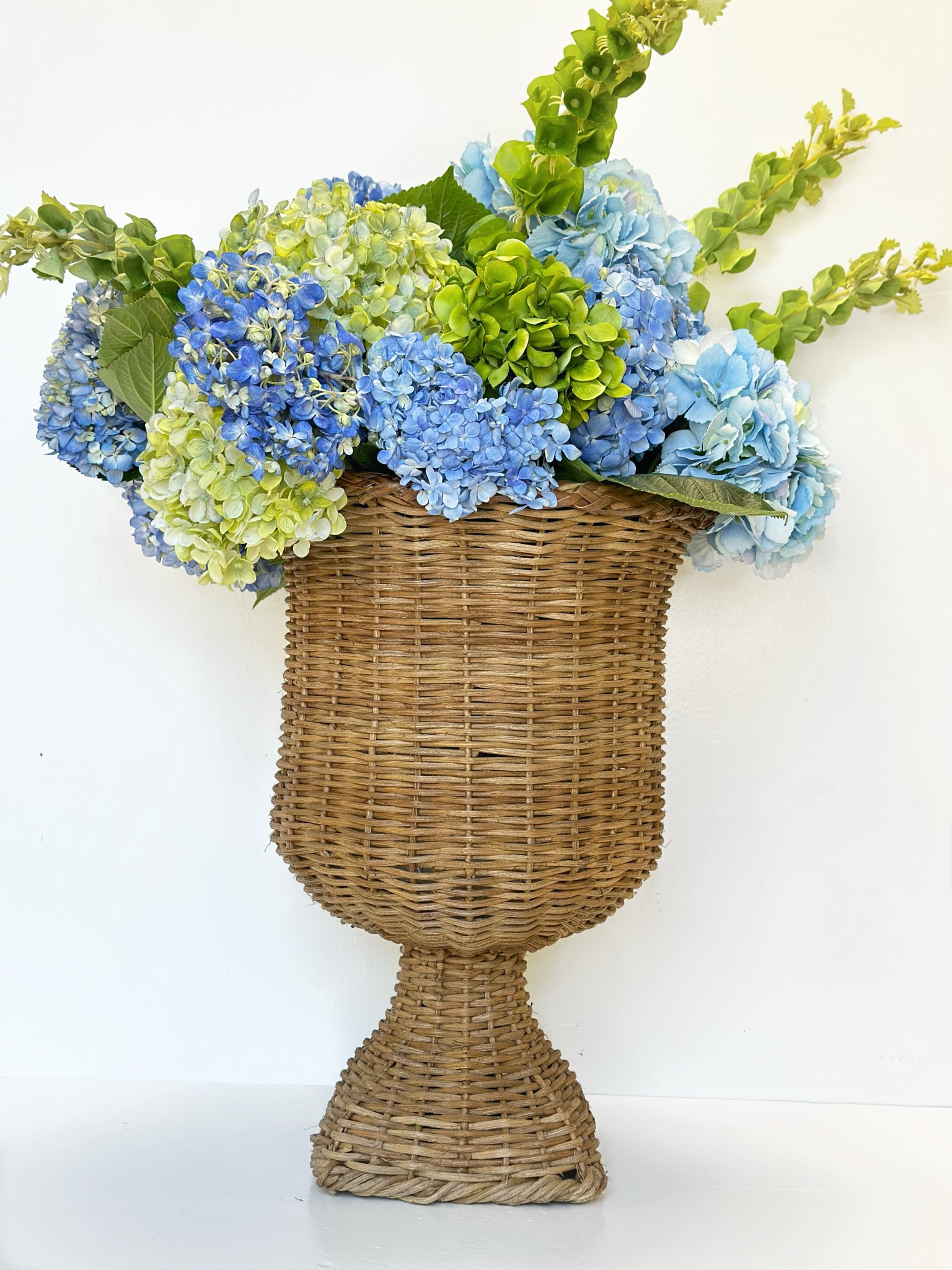 Thinking this natural rattan urn will be perfect for underneath my covered porch this spring and summer! 

#LTKSeasonal #LTKHome #LTKFindsUnder100