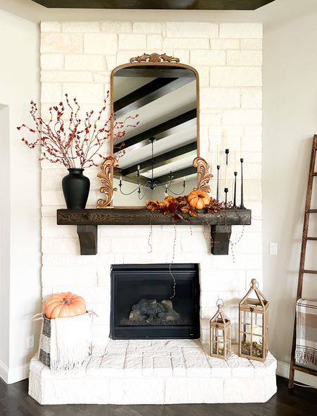 First, my mirror is on sale and a great price for this large size mirror, this sucker is huge! 46”x63” , almost as tall as me but it’s really hard to tell from this picture. Also, I did a really simple Fall mantle this year. Added bittersweet stems to my black vase and a big faux  pumpkin in my basket on the hearth. I also repurposed an old swag of fall leaves I already had. I took out the center bow and added the faux pumpkin and added some extra leaves I had to make it a little longer since my mantle is pretty wide. I am loving the simplicity of it this year!  
 #chiconashoestringdecorating #fallmantle #falldecor #thanksgivingmantle 

#LTKhome #LTKSeasonal #LTKHoliday