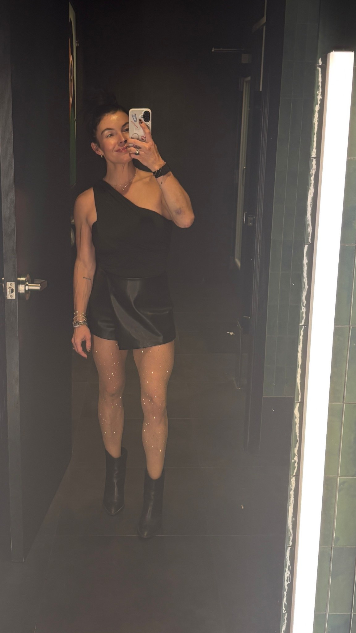 cutie girls night or date night outfit!
The most flattering bodysuit & skort!
Wearing small skort & XS bodysuit 🖤
Crystal tights are SO good  

Black leather skirt, black leather skort, leather, date night, black booties, black boots, bodysuit, girls night, sparkle tights


#LTKStyleTip #LTKFindsUnder50 #LTKHoliday