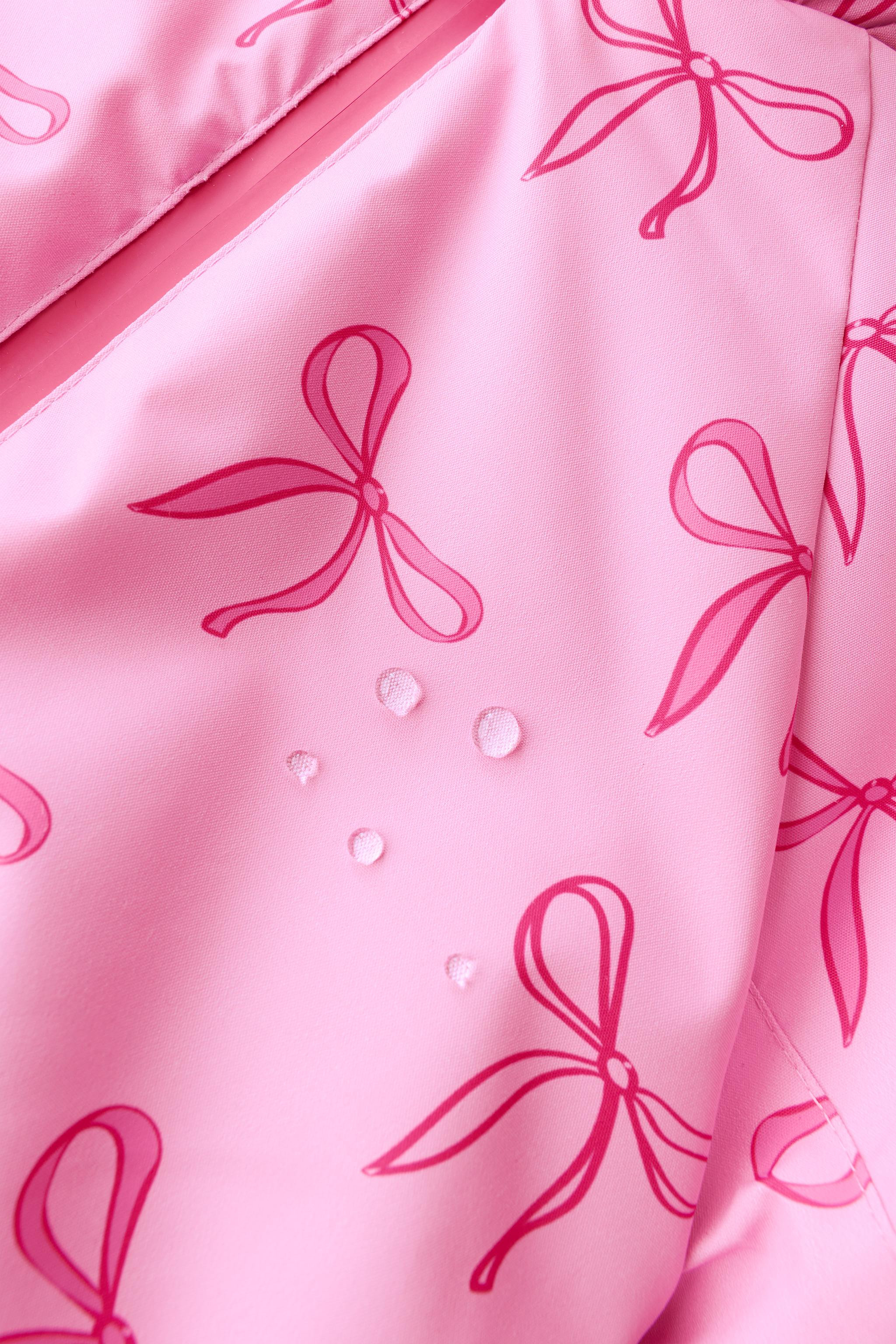 LONG WATER-RESISTANT AND WINDPROOF JUMPSUIT WITH BOWS | Zara UK
