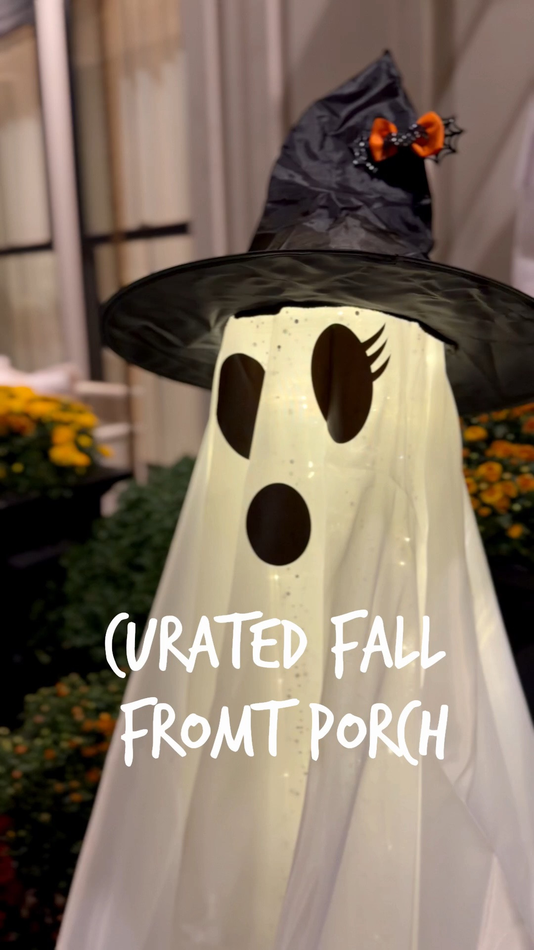 I've done the work for you...

1. Hang a wreath
2. Layer the door mats
3. Add mums to 2 tall planters and 2 shorter planters
4. Flank the doors with battery-operated taller ghosts. 
5. Hang solar-powered ghosts. 

@Wayfair