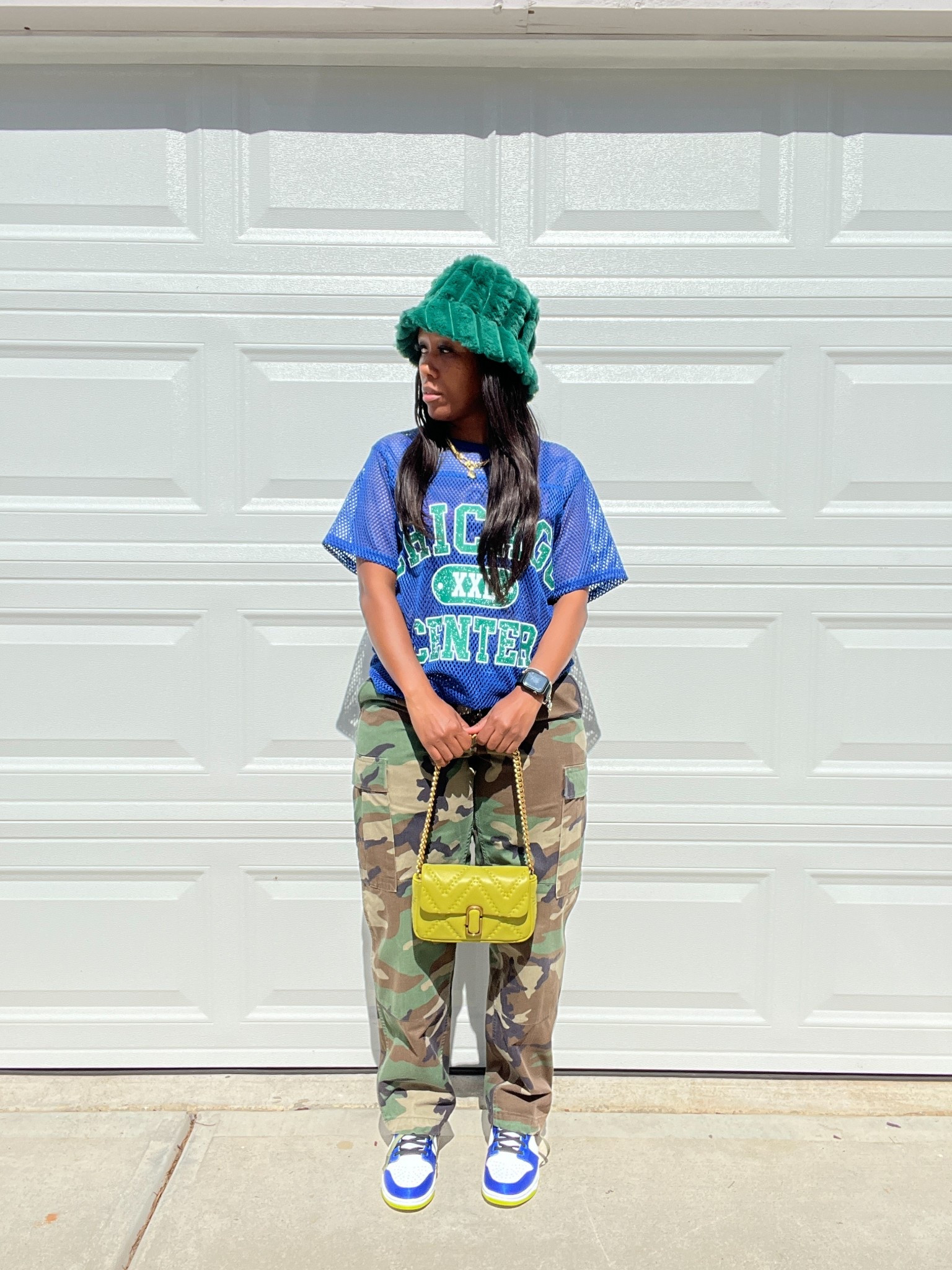 Outfit of the day 💙 I’m wearing a blue and green football jersey style with camo cargo pants, green fluffy bucket hat, lime Marc Jacob’s mini bag and Nike Dunk High Blue Satin

#LTKStyleTip #LTKFindsUnder50 #LTKShoeCrush
