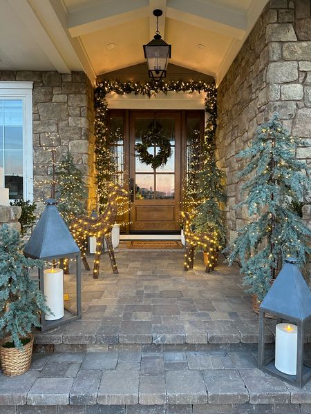 Holiday Front Porch

Lit faux draping tree | lanterns | twinkling twig trees | lit reindeer | front door | curb appeal

#LTKhome #LTKSeasonal #LTKHoliday