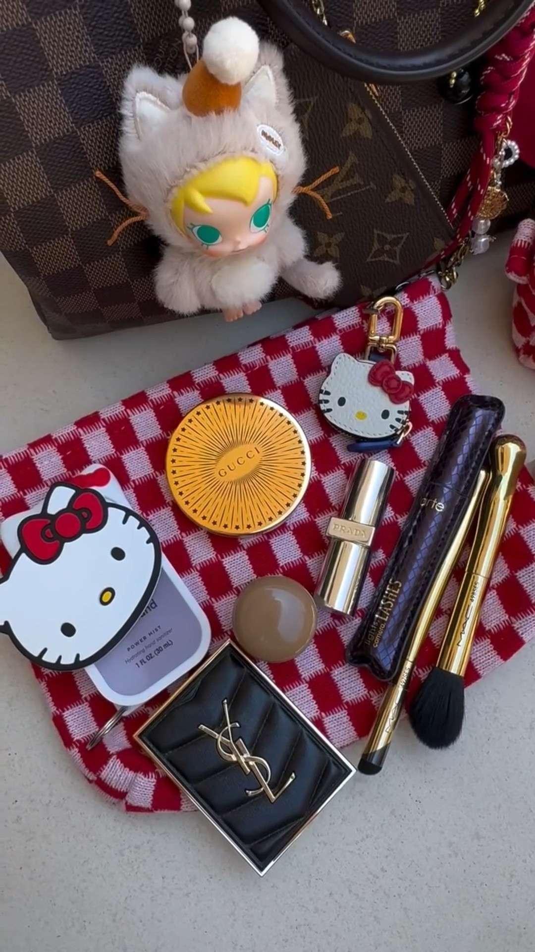 Red checkered pouches = my secret to switching bags daily without losing my mind. I don’t carry my make up with me daily but these are some of my favorite items in my daily routine…Rhode blush, Fenty gloss, Typology serum—chef’s kiss 💋✨ 

#whatsinmybag #everydayessentials #rhode #typeology #fentybeauty