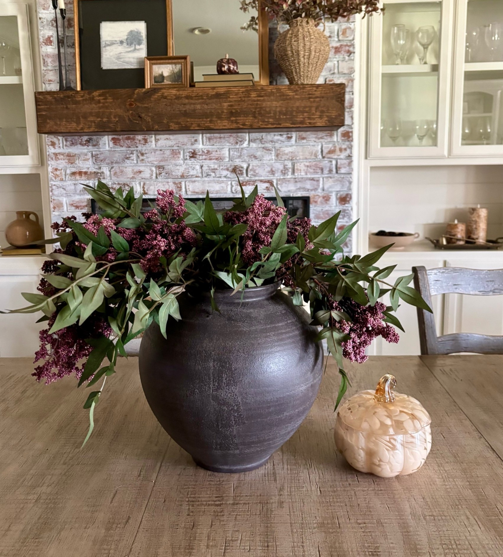 Just saw this beautiful black vase from @Target is back in stock!  It’s a large size and only $40!  A great price for the size and easy to style year round!  Styled with my favorite Amazon dusty plum berry stems!

#LTKHome #LTKSeasonal
