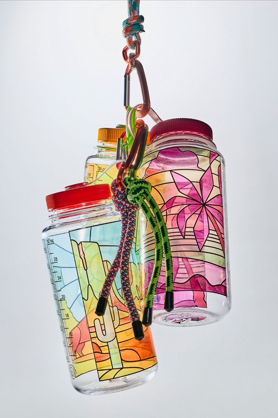 Free People Nalgene Stained Glass Water Bottle - Made with 50% waste plastic, this water bottle from Nalgene features a stained glass design, inspired by breathtaking landscapes in the great outdoors. Colorful, unique, and responsible, this 32 oz. water bottle is perfect for your workouts, backpacking trips, and everyday adventures

#LTKselfcare #LTKTravel #LTKActive