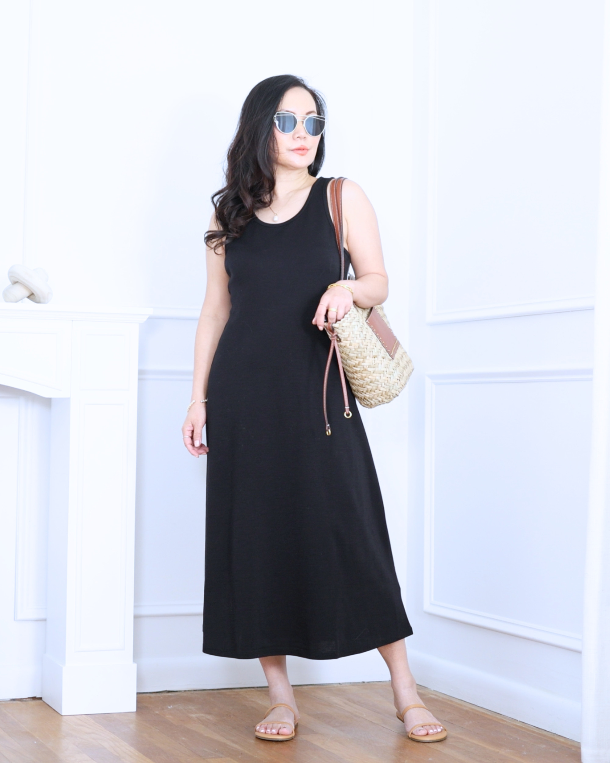 Black long dress from Unbound Merino paired with a large straw bag from Mango and strappy sandals from Amazon — simple, breezy, and effortlessly chic for warm everyday moments. I'm 5'2, wearing size S. 

 #LTKootd #LTKOver40 #LTKPetite