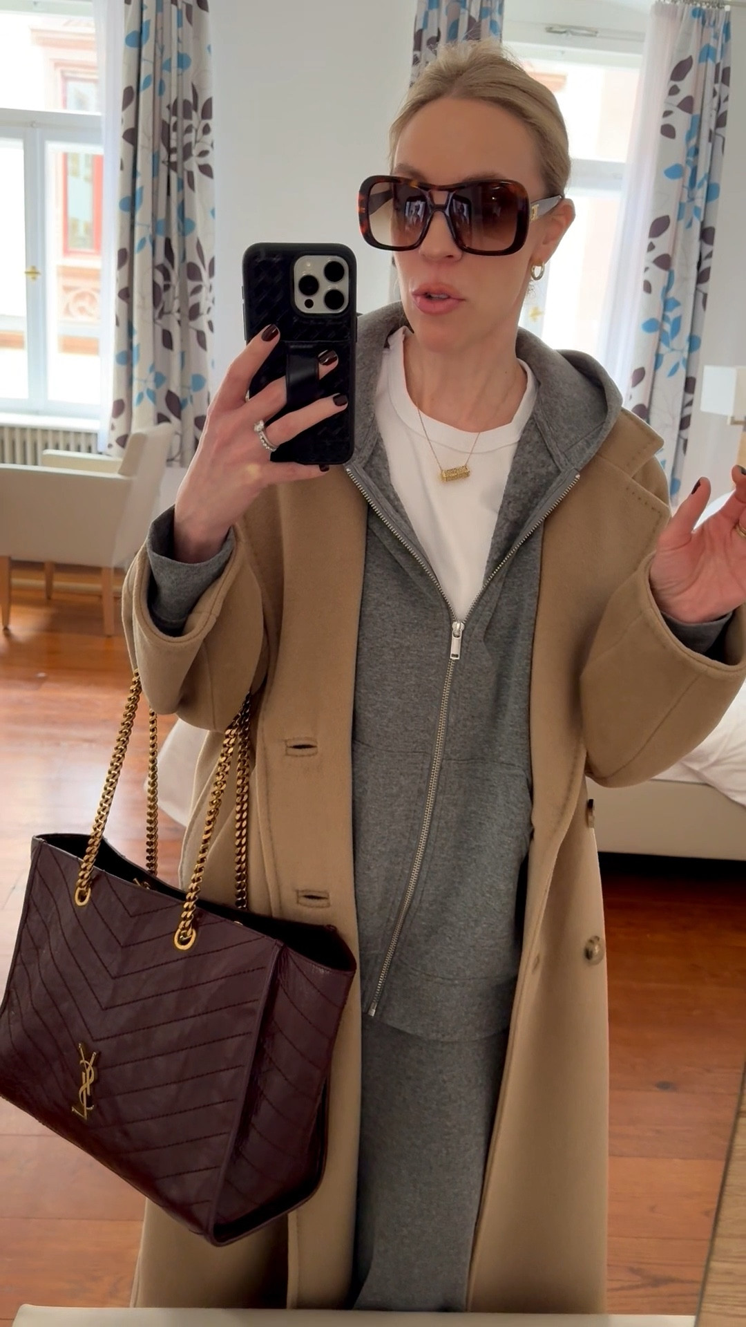 Travel look of the day, airport outfit, gray hoodie sweatsuit, camel coat, Adidas Samba sneakers, burgundy YSL tote bag

#LTKootd #LTKTravel #LTKdayinmylife