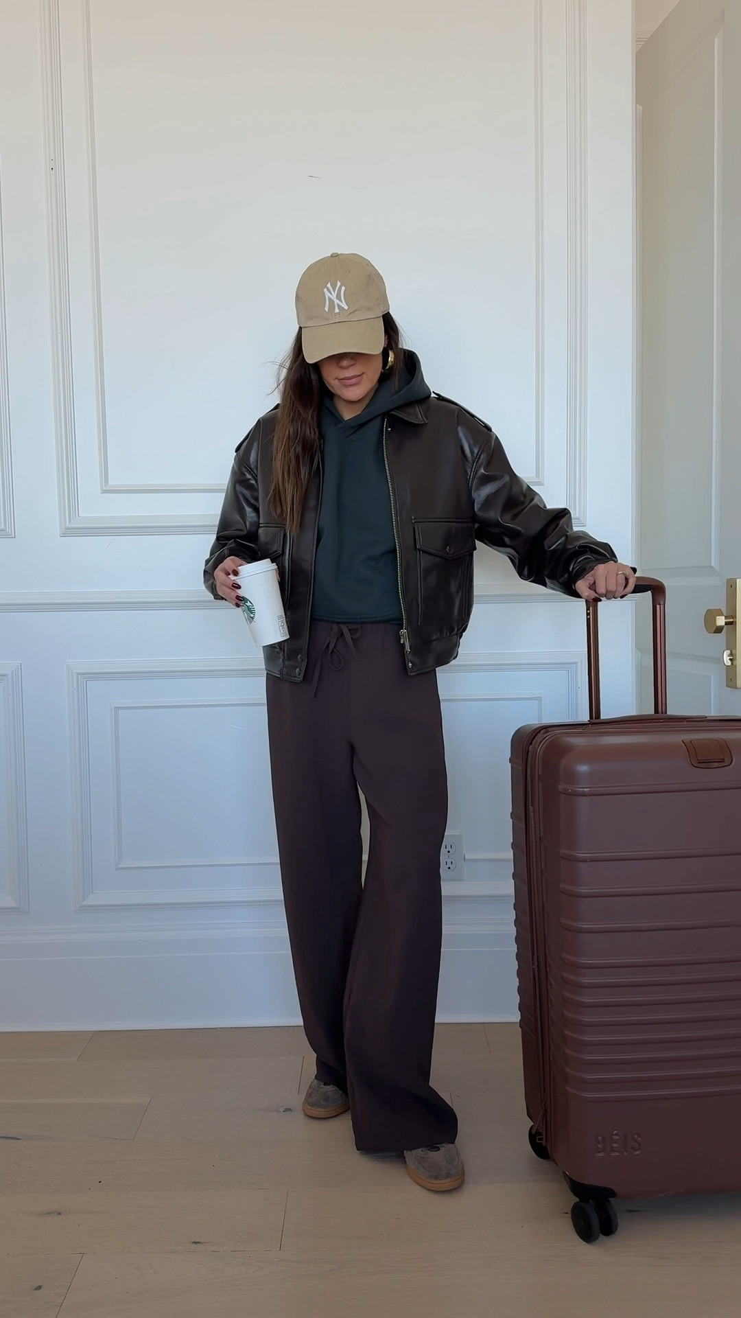 Travel outfit ✈️ loving this new leather bomber jacket! And these wide legs pants are my must have travel pants! So comfy and wrinkle free 🤍

Sizing:
Pants- small
Hoodie- medium
Jacket- small

Travel outfit, airport outfit, airplane outfit, aritzia, Beis suitcase, brown suitcase, brown pants, travel pants, aritzia coat
@aritzia @adidas @beis @amazonfashion

#LTKStyleTip #LTKootd #LTKTravel