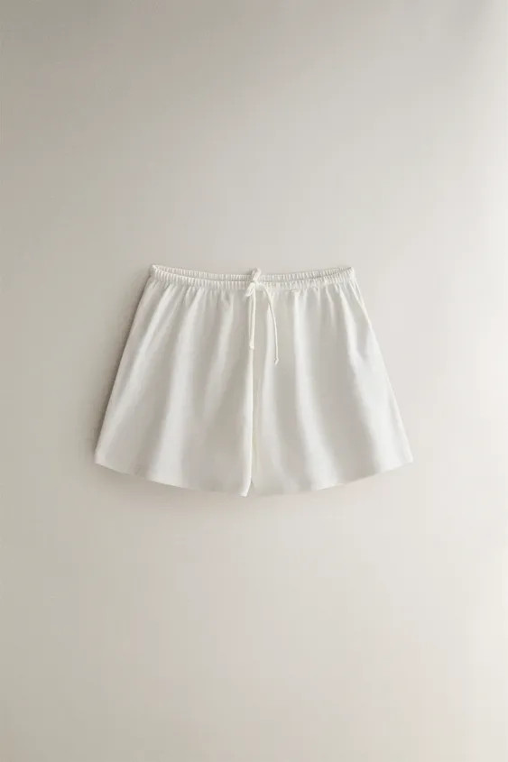 Shorts made of cotton jersey fabric with an elastic waistband and adjustable drawstring. | Zara US