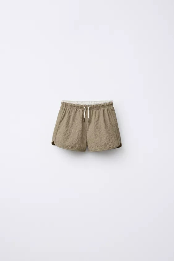 Swim shorts with elastic waistband and adjustable front drawstring. Back patch pocket. Interior m... | Zara US