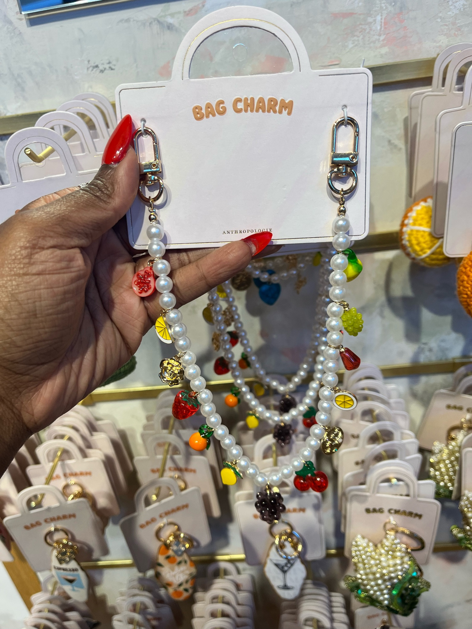 Bag charms are still going strong into spring and summer! By Anthropologie Icon Pearl Bag Char