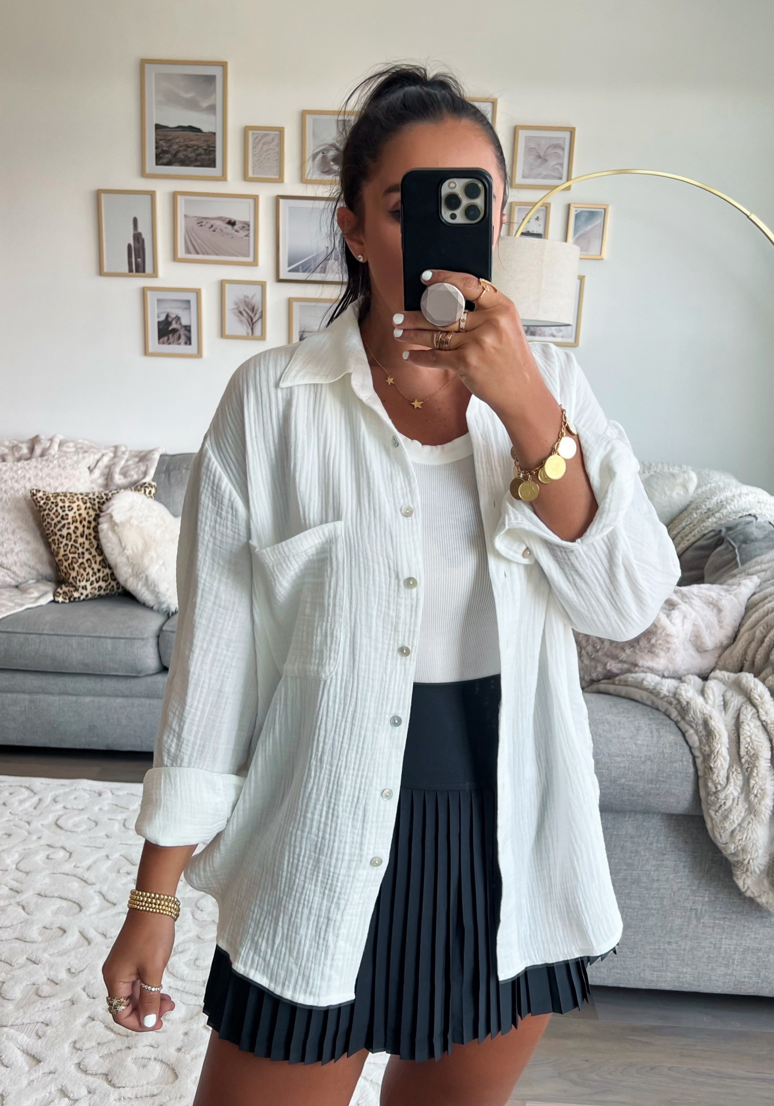 Alo yoga skirt wearing size medium. All saints White tank top wearing size small. White button up wearing size small