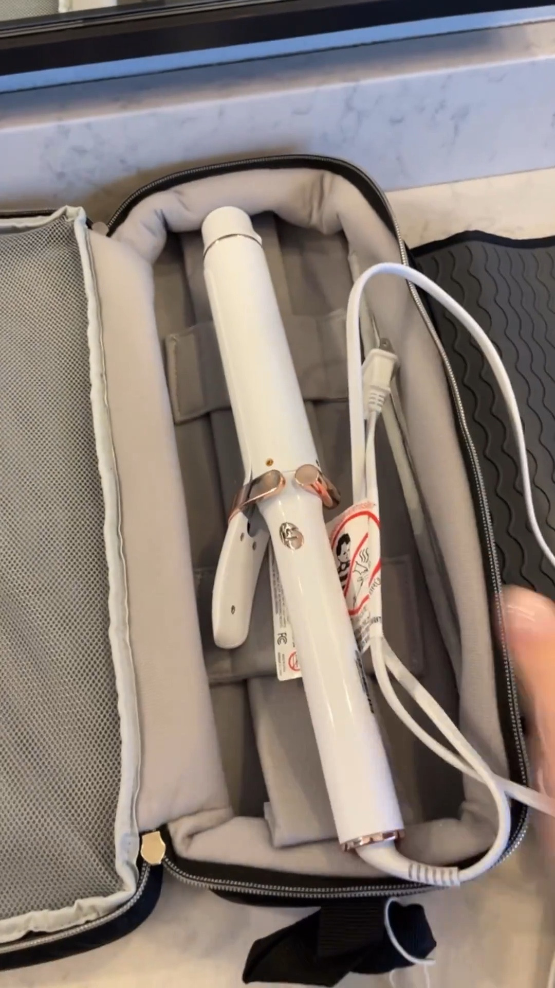 Hairstylist approved

This 2-in-1 design hair tool holder combines a hair case with a large open main compartment and a silicone heat-resistant mat. These must-have travel essentials help you carry your hair tools wherever you go. Perfect for those long barrel hot tools.

