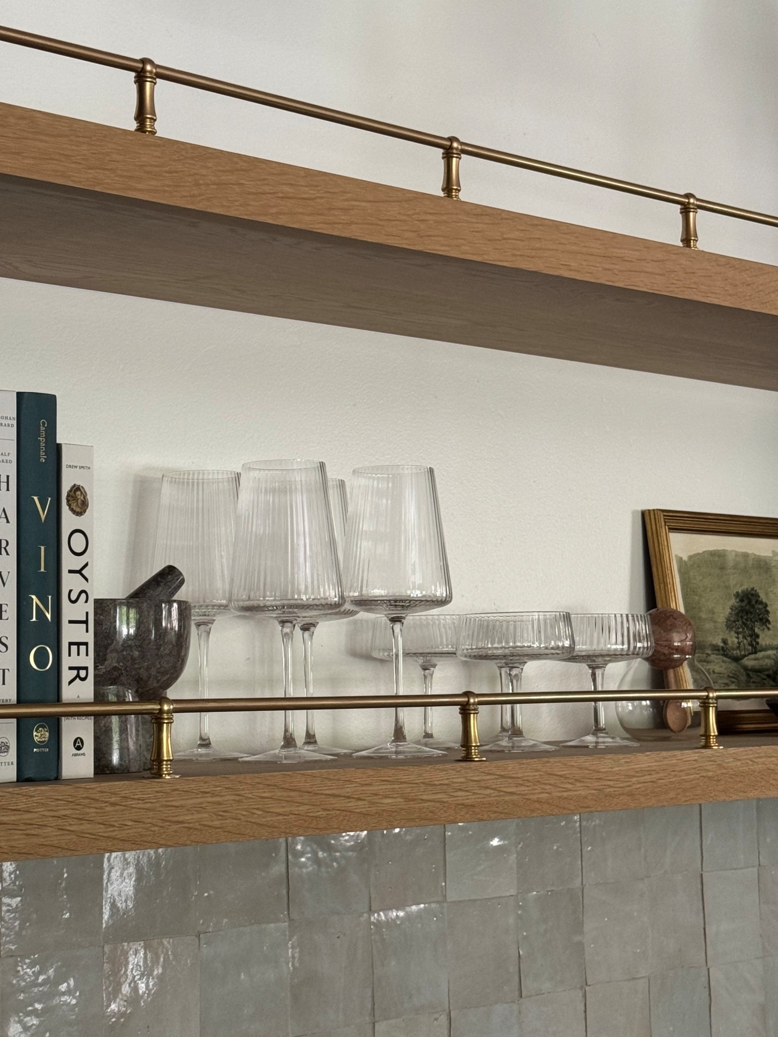 Added a gallery rail to our breakfast nook and I’m so happy with how it turned out! 
The rods came a little more shiny and yellow so I added antique brass rub n buff to them and it did the trick!



#LTKHome