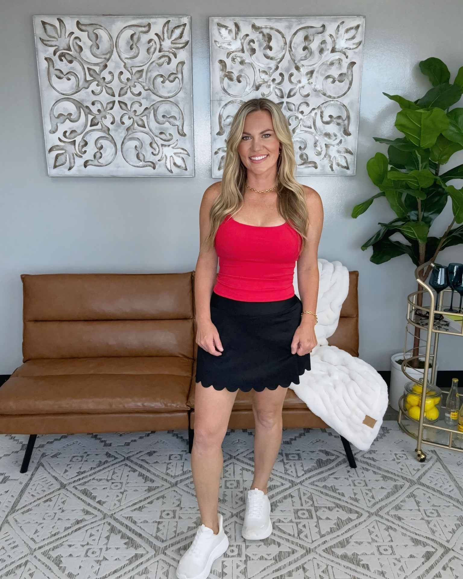 The scalloped skort adds a feminine touch while the fitted tank keeps the look sleek and flattering. An easy outfit for everything from errands and travel days to casual lunches and weekend plans. Finished with white sneakers for a clean, sporty look that still feels polished.

Sizing:
• Tank: Small
• Skort: Small
• Sneakers: Size 7.5, true to size

scalloped skort, black skort, athletic skort, fitted tank, red tank top, casual summer outfit, sporty chic style, weekend outfit, travel outfit, everyday style, white sneakers, active lifestyle, elevated casual outfit, summer fashion, athleisure outfit, vacation style, women’s fashion, casual chic, AudrieDollins

#LTKfitnessgoals #LTKOver40 #LTKActive
