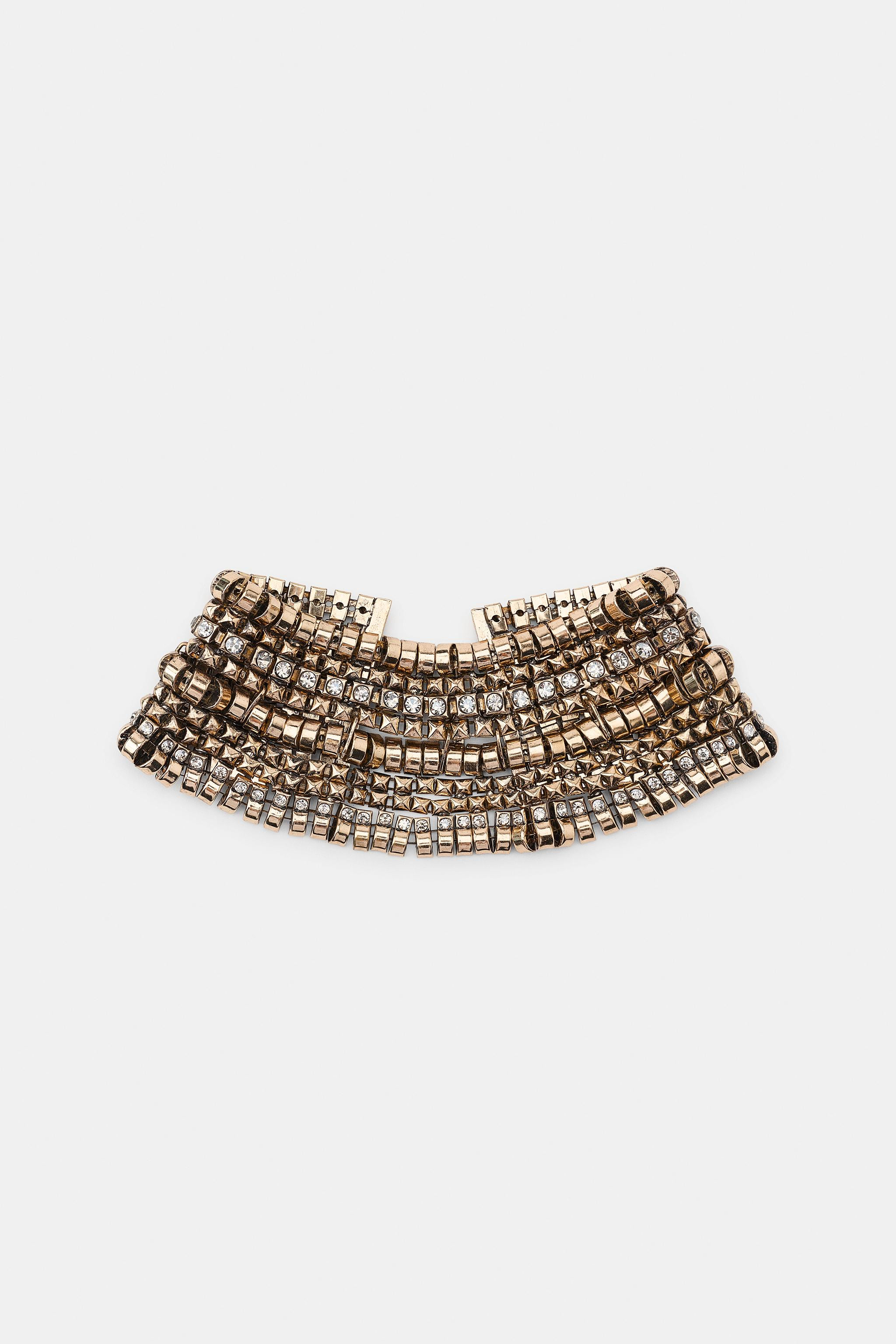 DescriptionContentsMeasurementsBib-style choker necklace featuring multiple metal pieces. Accente... | Zara US