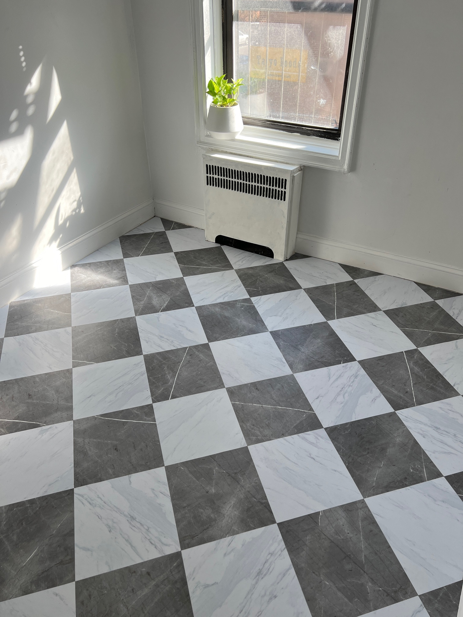 NEW FLOORS! It was an exciting day for the kitchen as it drastically transformed the space. The old floor consisted of cracked old tiles with grout lines that were too dirty to even get cleaned. We used peel & stick vinyl (these are the “Bonneville” pattern in white and charcoal from @wallpops x @chrislovesjulia) that were fairly easy to install, no tools need except to measure the cut offs. My husband is the real MVP for doing all the work 

#LTKhome
