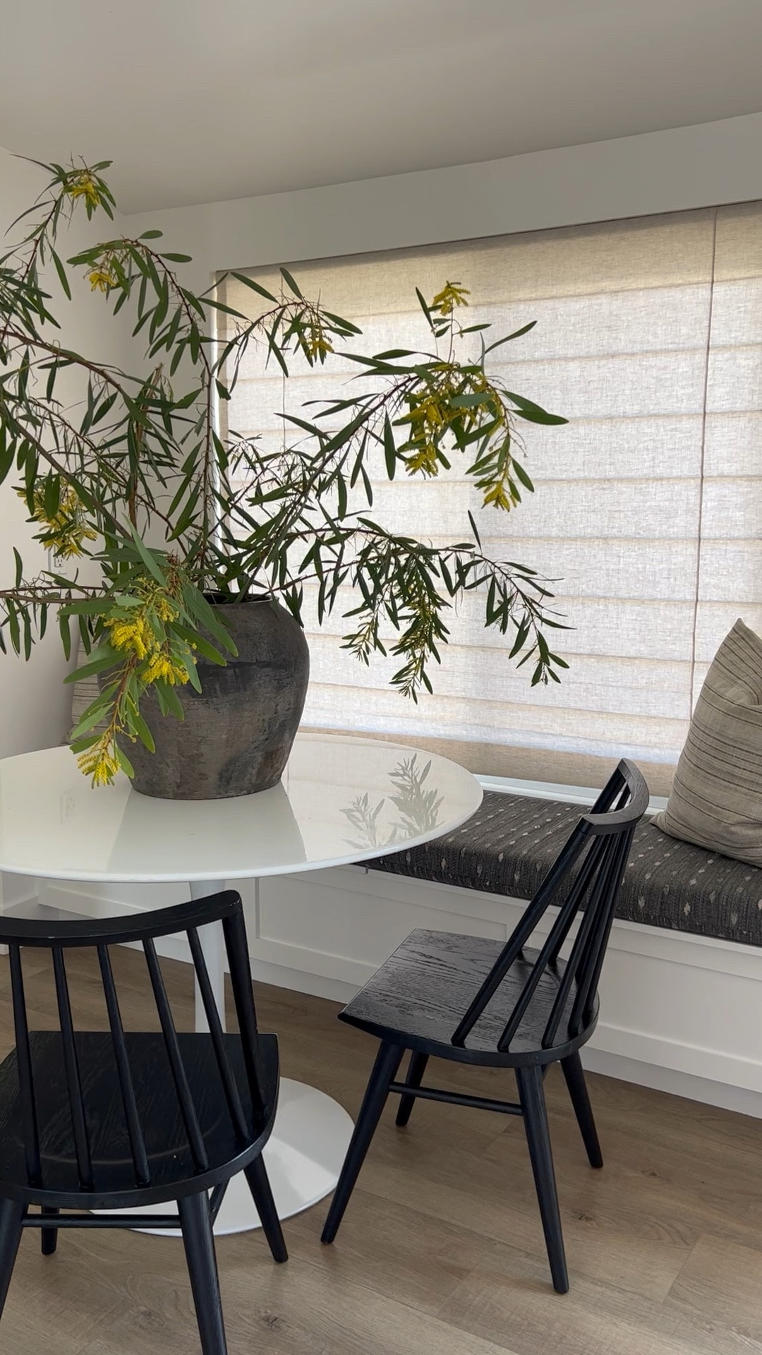 Neutral dining nook with classic furniture and vintage accessories.

Round dining table, black wood dining chairs, vintage vessel, flax linen shade, throw pillow, and custom upholstered bench cushion. 

Home finds, home decor, dinette,  breakfast nook. 


#LTKhome #LTKFind #LTKunder100