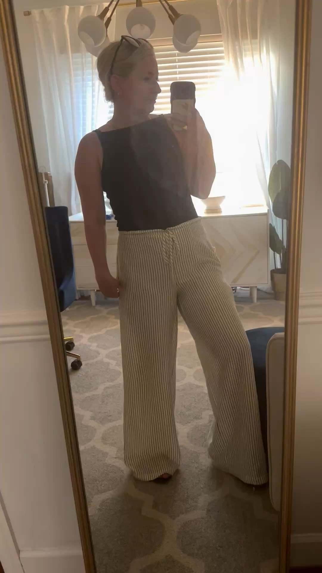 My simple summer go to outfit.
Easy light pants with a vertical stripe. Lined in the booty area, pockets and tie waist. Paired with a simple black tank that has a high neck.

Vici code trilbysave35

#LTKootd #LTKOver40 #LTKWorkwear