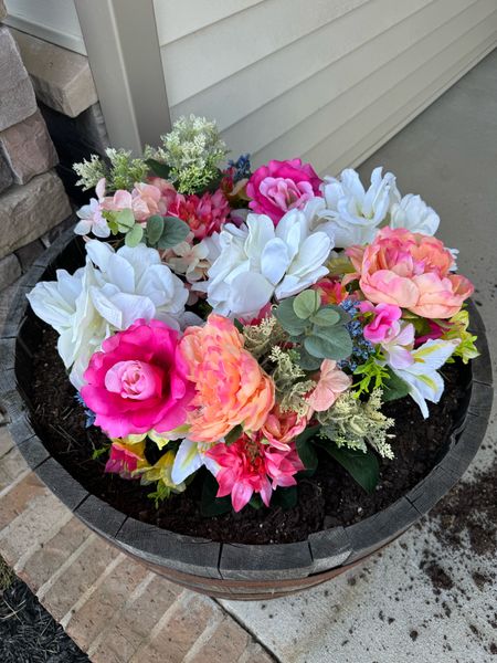 Planted fake flowers in this barrel planter on my front porch, and they look so pretty! And the best part is, I don’t have to remember to water them. Got the flowers from WalMart and chose a few different bundles of varieties.🌷

#LTKSeasonal #LTKhome