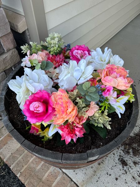 Planted fake flowers in Themis barrel planter on my front porch, and they look so pretty! And the best part is, I don’t have to remember to water them. Got the flowers from WalMart and chose a few different bundles of varieties.🌷

#LTKhome #LTKSeasonal