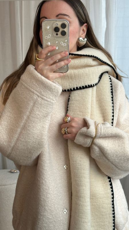 Snowy whites for the snow days 🤍🖤
Toteme blanket scarf coat dupe | Cream wool coat | Borg oversized bomber jacket | Blanket stitch scarf | Mejuri necklace | Heart earrings | Bow phone case | Monica Vinader rings | Winter outfit ideas 

#LTKover40 #LTKSeasonal #LTKstyletip