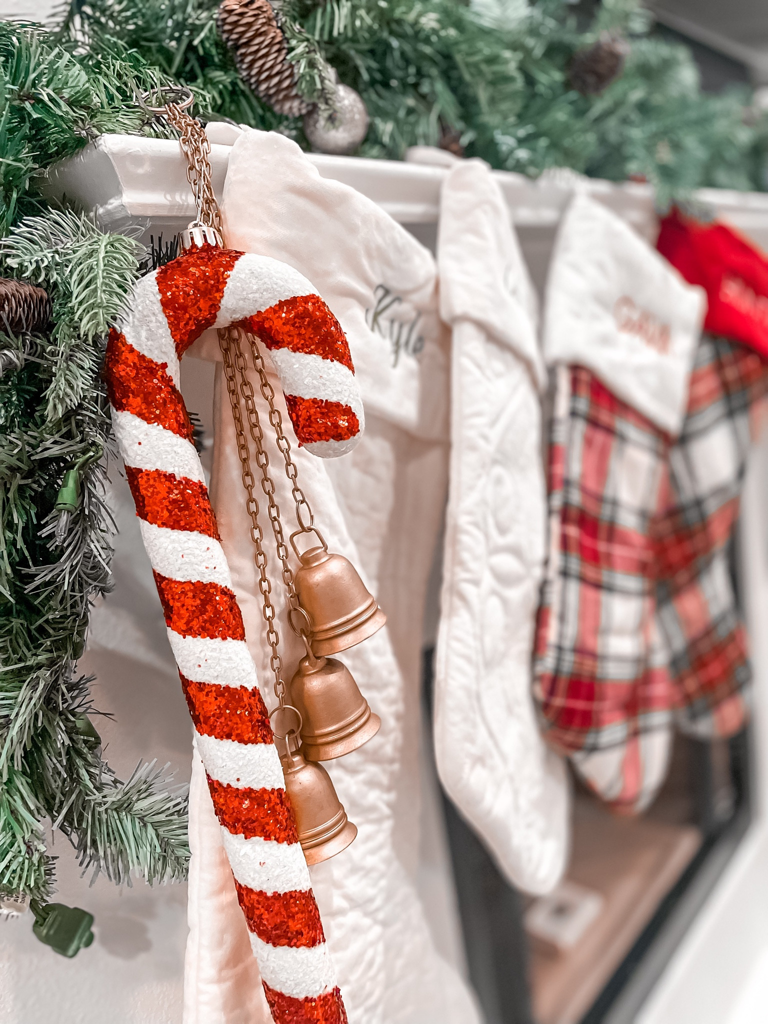 Garland Christmas mantle Christmas stockings from Pottery Barn & hanging bells

#LTKsalealert #LTKhome #LTKHoliday