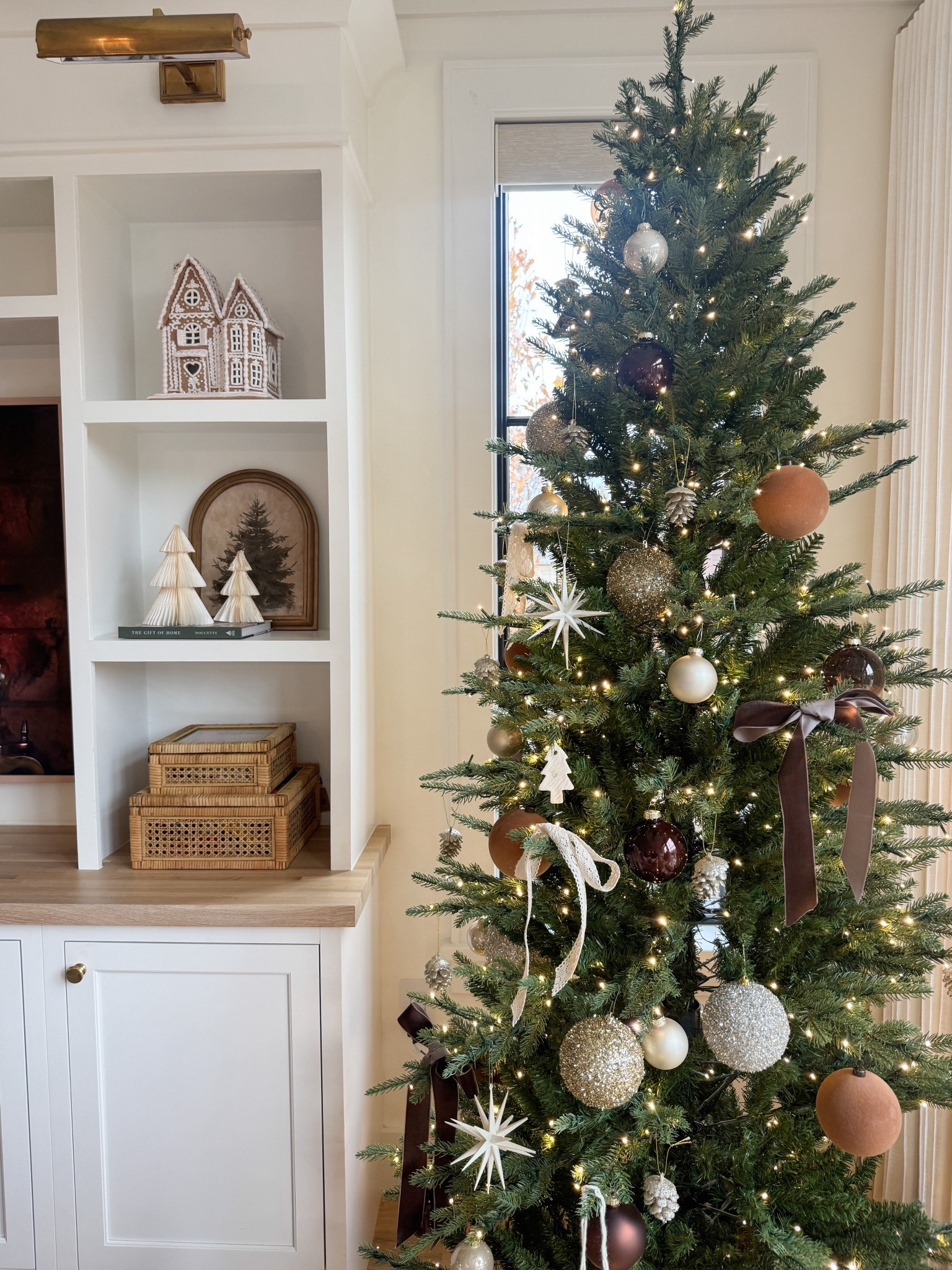 Sharing all the pieces I used to create our neutral Christmas tree look this year—layered gold, silver, ivory, and deep browns with velvet chocolate ribbon and soft ivory lace. Subtle shimmer, warm tones, and a sneak peek at our shelf decor, too. Everything is linked to shop.

#LTKHoliday #LTKHome #LTKSeasonal