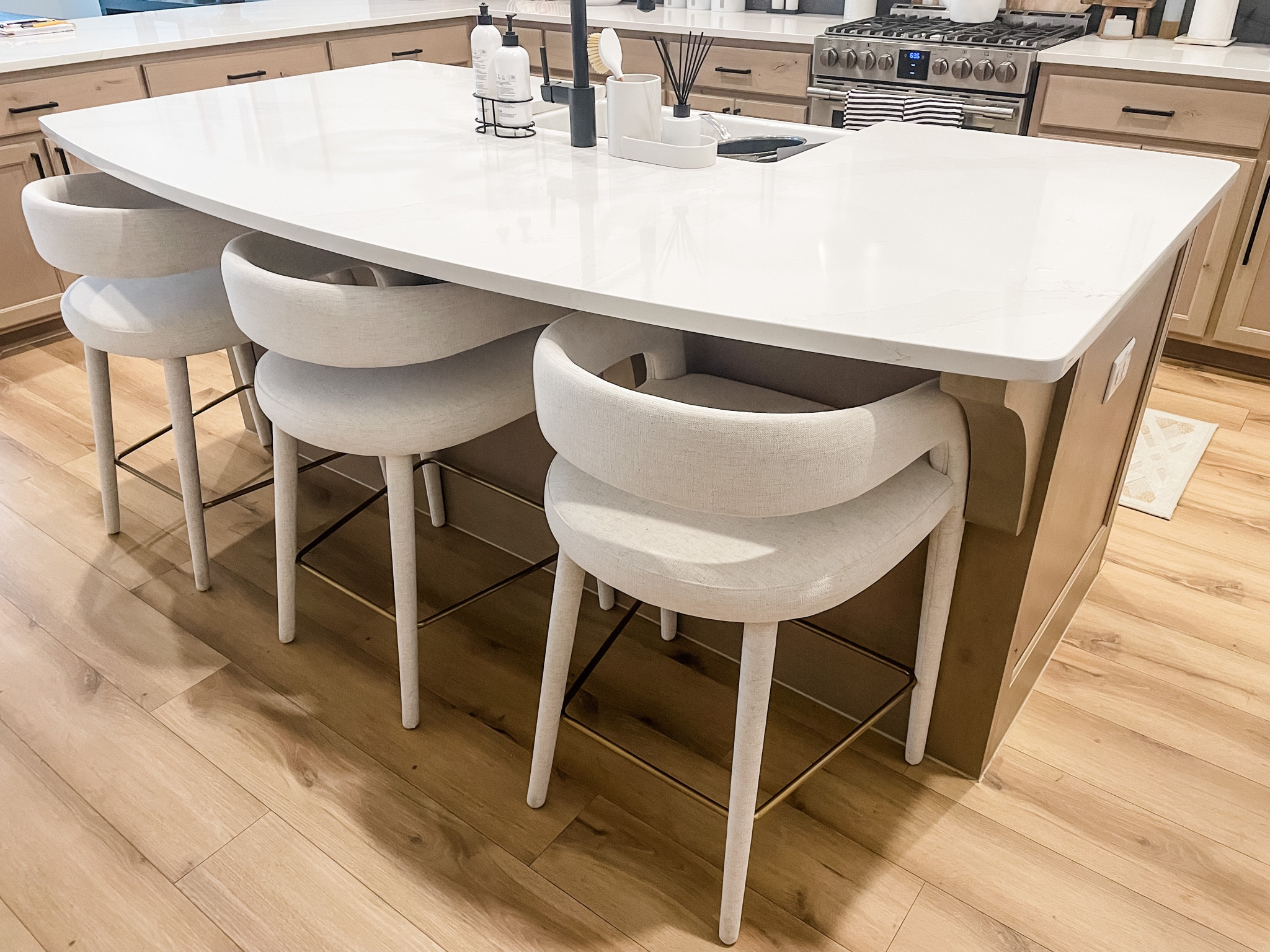 The dreamiest bar stools. This updated take on a traditional barrel chair design combined with the upholstered linen make these chairs the perfect vibe for our home. 

These come in bar or counter height. 