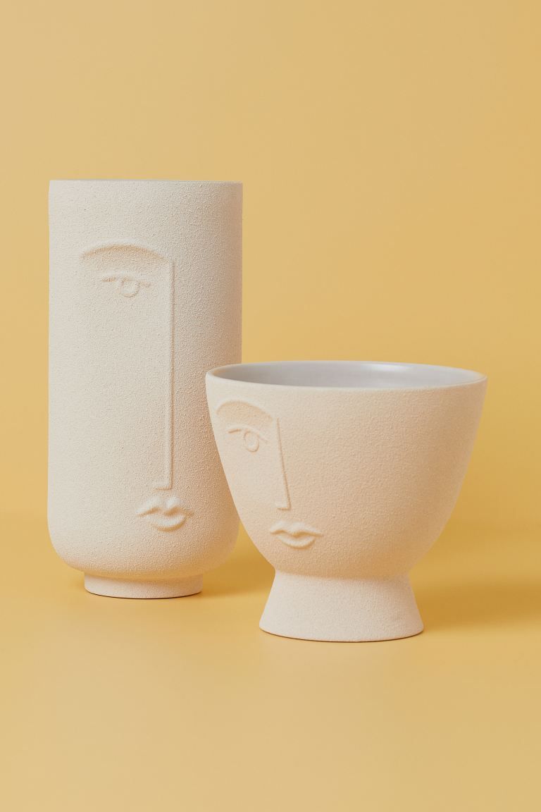 Ceramic plant pot with a face design. Height 11 1/4. Diameter 5 in. | H&M (US)