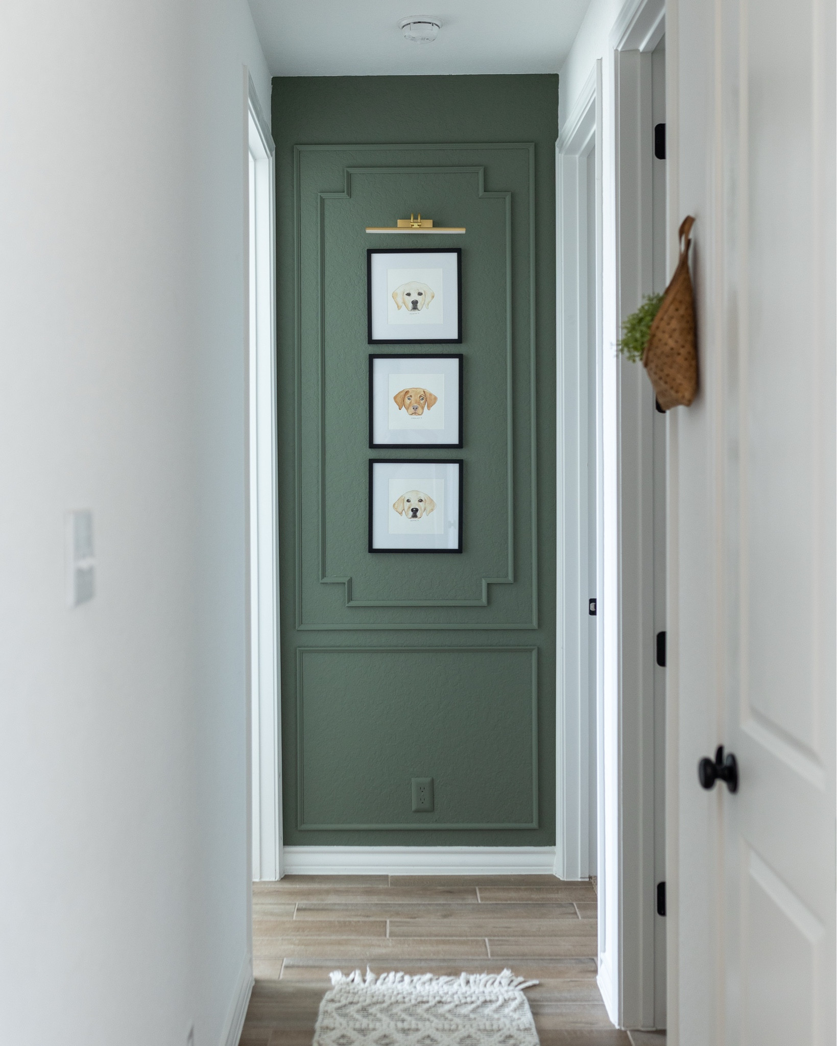 My favorite little nook in our home! I loved adding some interest to this wall with some picture frame molding and frames with watercolor artwork of the pups.

#LTKPets #LTKHome