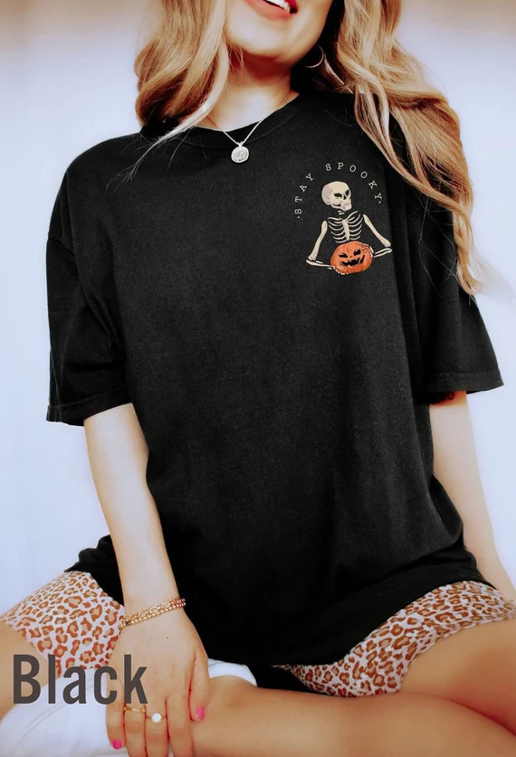 Comfort Colors® Stay Spooky t-shirt, minimal Halloween t-shirt, Skeleton pocket sweatshirt, Skel... | Etsy (US)