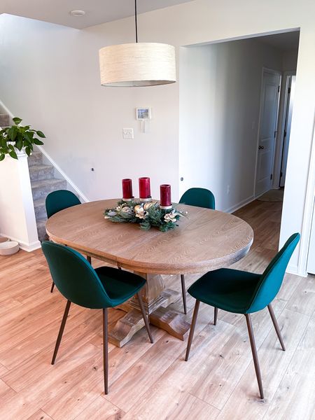 Oval round wood dining table with forest green upholstered chairs 

Perfect timing for Christmas decor! 

#diningtable #greendiningchairs #rounddiningtable #upholstereddiningchairs #scandinaviandecor 

#LTKSeasonal #LTKHoliday #LTKhome