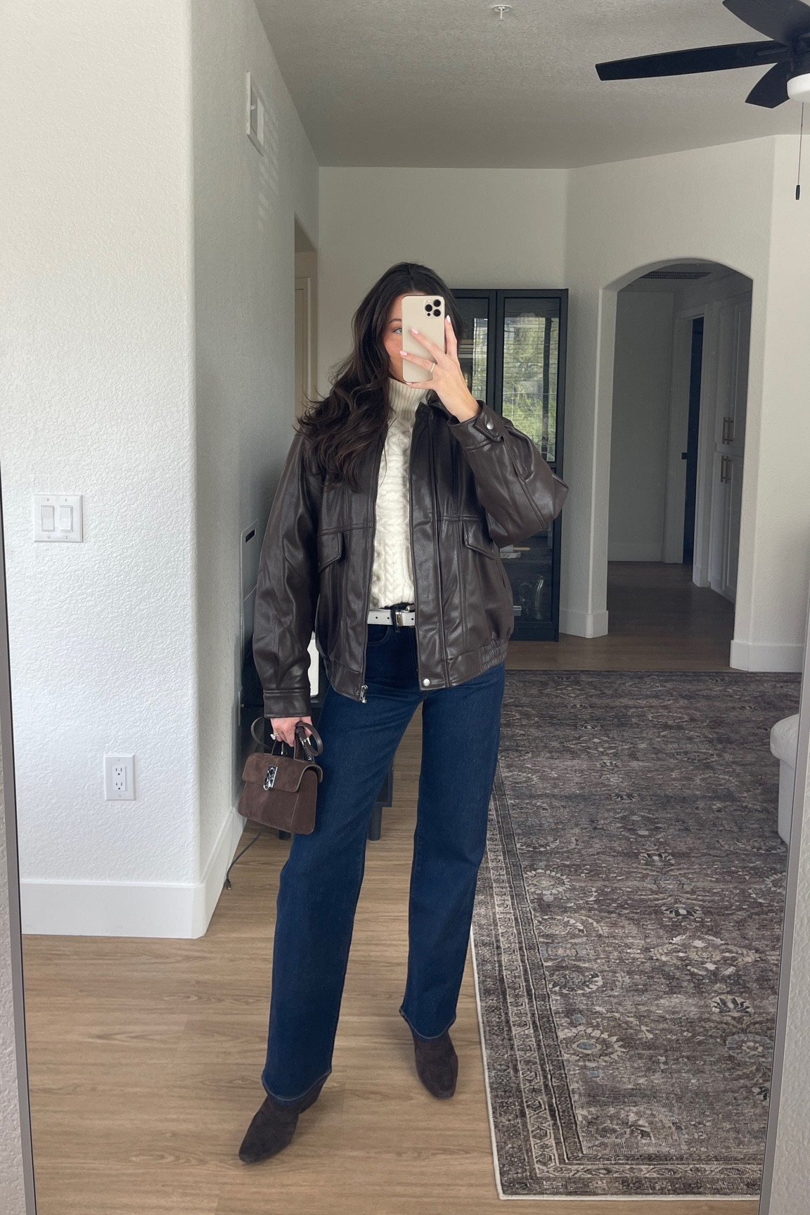 Leather jacket, cable knit sweater, dark wash jeans with pops of western in the belt & boots! Linking a ton of similar items :)

#LTKSeasonal #LTKHoliday #LTKStyleTip
