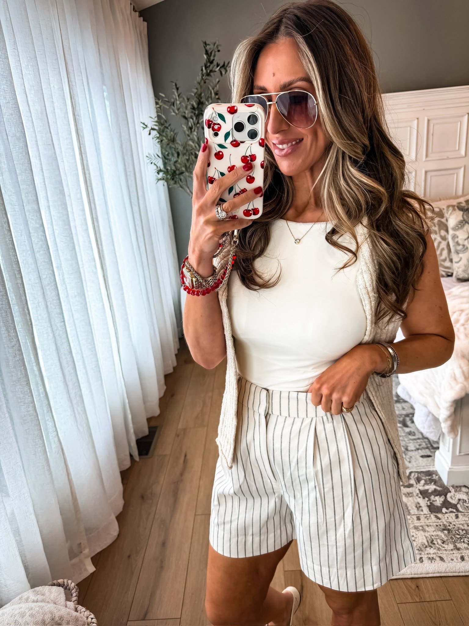 This elevated spring outfit is perfect for a brunch with the girls.
Spring and summer outfit inspo, pinstripe shorts, classic outfit, themominstyle 

#LTKOver40 #LTKootd #LTKSeasonal