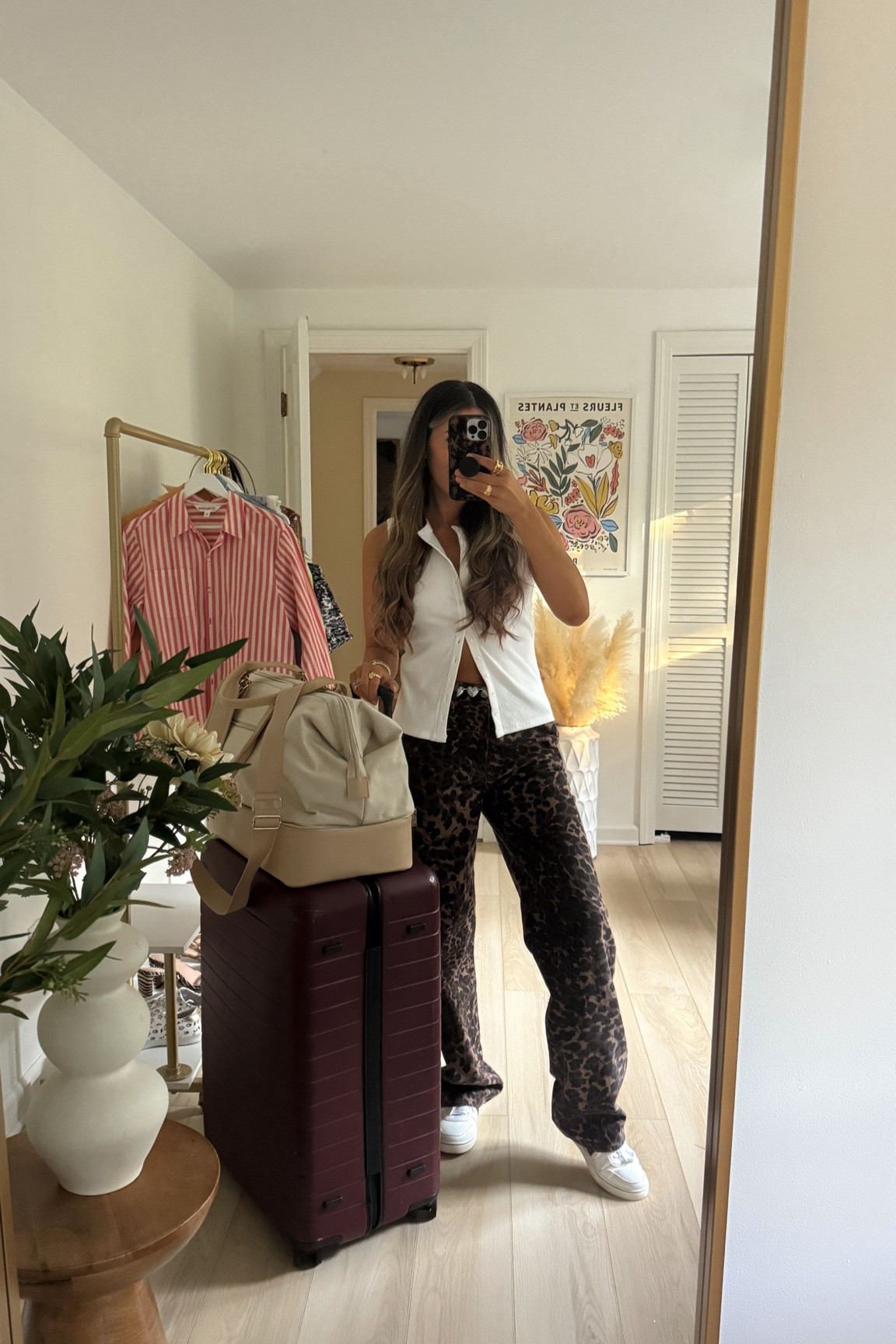 NYC travel outfit — leopard denim jeans (26 long) and white button front top (small)

#LTKStyleTip #LTKFindsUnder100 #LTKNYFW