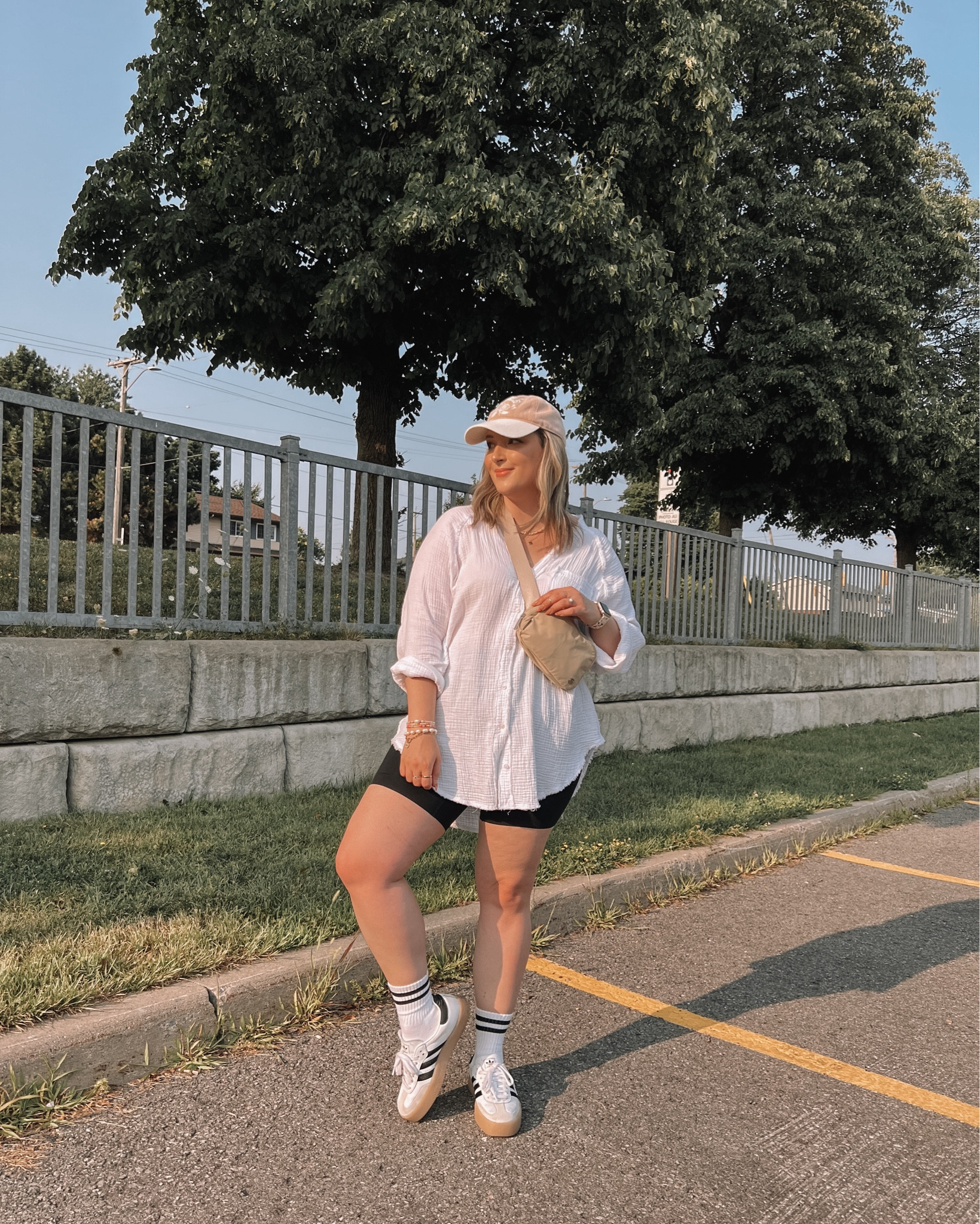 Midsize athleisure outfit - oversized button up shirt (linked this year’s version),  black biker shorts (size L), adidas sambas (size down .5), lululemon belt bag
 

#LTKmidsize #LTKsummer #LTKcanada