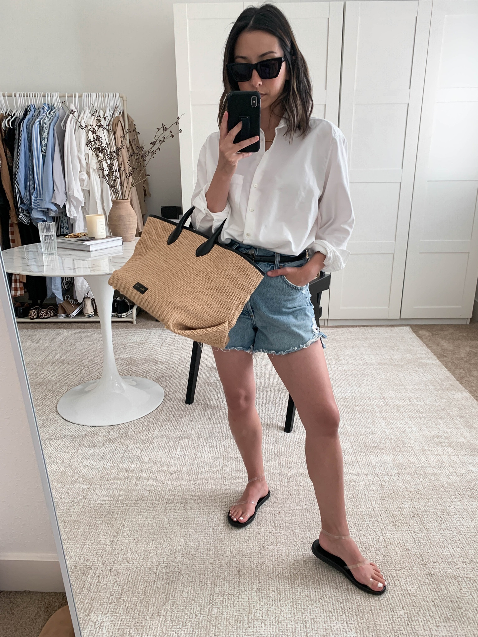 Daily #ootd. Summer to fall transitional outfits. Favorite white button down. 

Shirt - AYR xs
Shorts - AGOLDE 26. Sizes up 2 sizes. 
Sandals - Ancient Greek 35
Tote - Khaite 
Sunglasses - YSL
