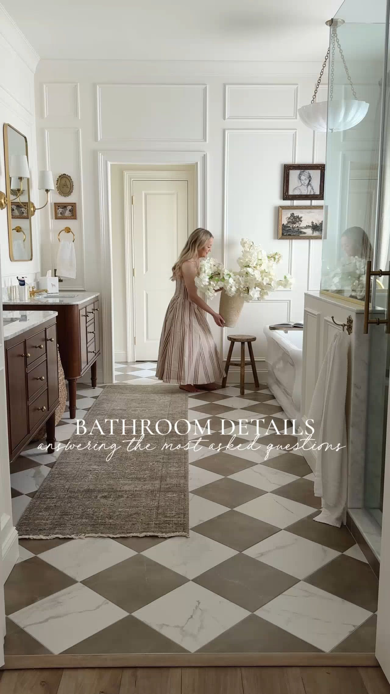 Answering some of the questions I get asked most often about our primary bathroom!

Comment “details” to shop this space! 

Where is the flooring from?
The flooring is from @boardwalk_hardwood! We used the @Anatolia Classic Collection in the colors Calacatta and Pulpis Mocha in a 12x12 size. It was one of my favorite design decisions in this space and adds so much character.

Why did you choose unlacquered brass?
I chose unlacquered brass because I love that it naturally ages over time. Instead of staying the exact same forever, it develops character and warmth with use, giving the space a lived in, timeless feel. It’s one of those finishes that just gets more beautiful as the years go by, and I knew it was something I’d love long term.

Where is the toilet?
The toilet is tucked away on the right side after you walk past the tub. I really wanted it to be out of sight so it isn’t the first thing you see when you walk into the bathroom. It helps the space feel a little more like a spa.

Where do you store everything?
We have a storage closet that’s still very builder grade with the original wire shelving, but it’s definitely on my DIY list! I’d love to replace the wire shelves with custom built-ins to make the space much more functional. We also have two small shower niches. One is visible for our everyday products, and the other is hidden, which is where we keep all of the extra bottles and clutter out of sight. I wanted everything to have a place without the bathroom feeling cluttered.

Is the glass hard to keep clean?
Honestly, it’s been pretty easy to maintain. I just use a spray glass cleaner and wipe it down regularly. Our previous primary bathroom had a glass shower too, so I’m used to it. Water spots will happen, but as long as you stay on top of cleaning it, they don’t really build up or become an issue.